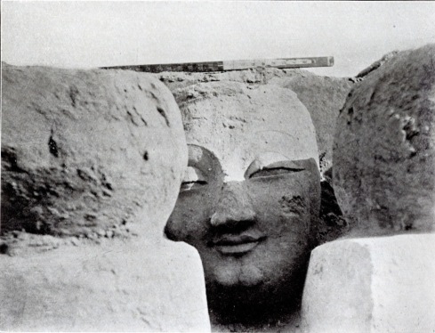 Stucco head of colossal Buddha figure at ruined shrine Miran